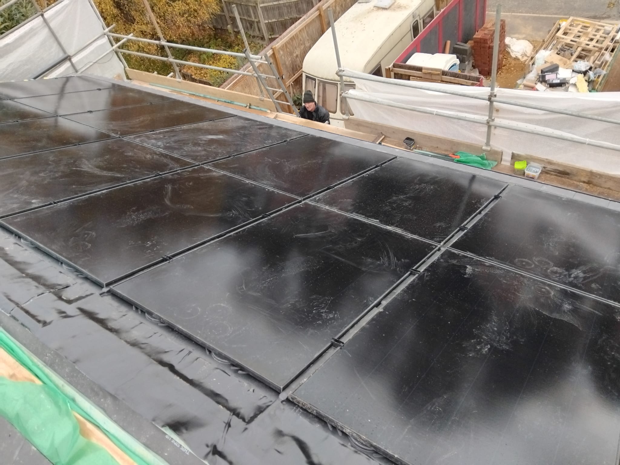 Solar panels beneath cloudy sky