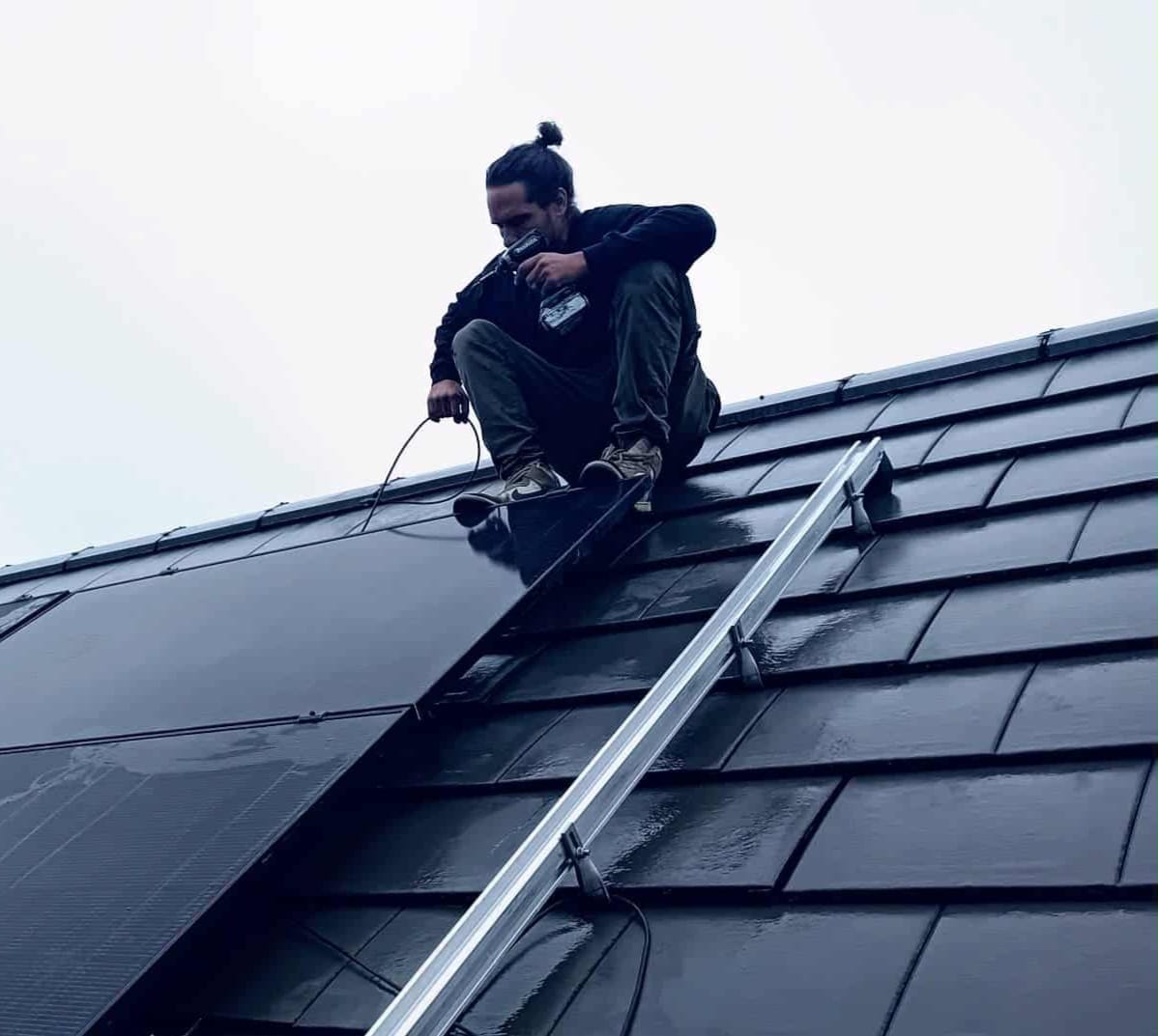 Solar worker holding panel